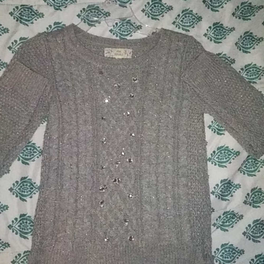 A grey sweater.